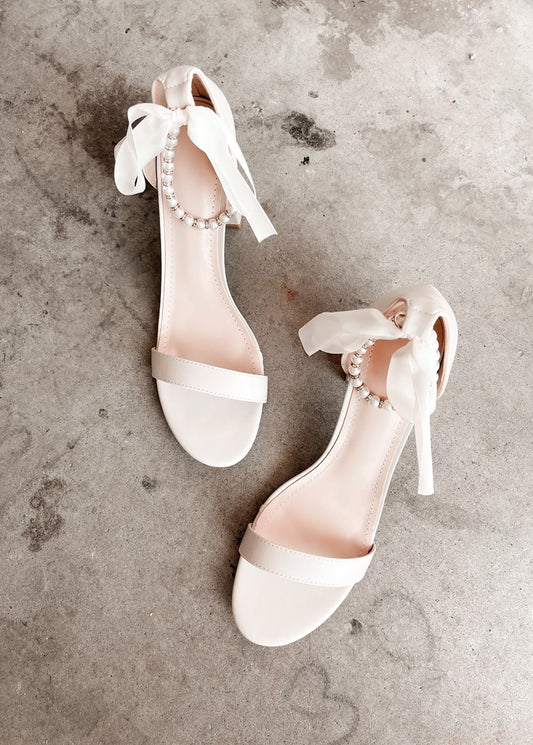 Trish Pearl Ankle Strap Bow Heels in Sand