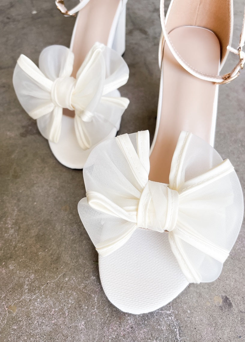 Rosalyn Knot Bow with Ankle Strap Heels in Ivory, Front View Close Up